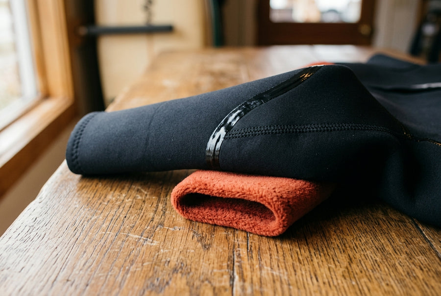 Close-up of the seams and neoprene of a bodyboarding wetsuit